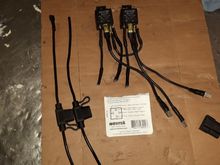 The three short wiring leads plug into the main wiring harness. The three long leads  plug into the headlight extension harness. And the two wires that were separated and I have to put connections on them will plug into the same spot as the long leads.
