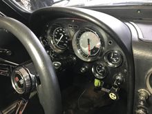 The green tape under the dash are the calibration push buttons for the tach and speedo. 
