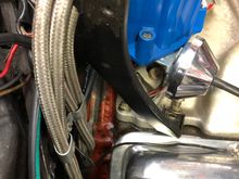 Passenger bracket is second bolt from firewall on Edelbrock Manifold 