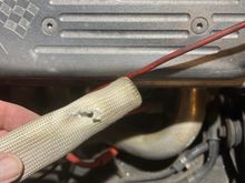 Burned through the “protective” sleeve.