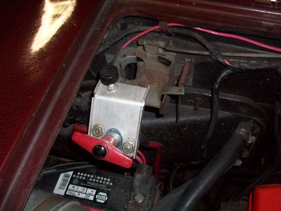 Battery Cut Off on hood latch.