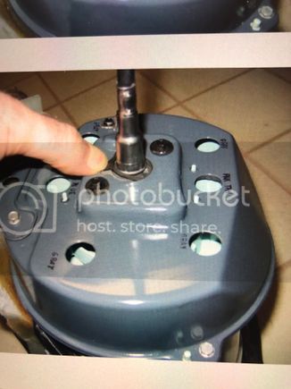 By pushing the cable towards the speedo head, you will be releasing the tension on the spring like clamp.