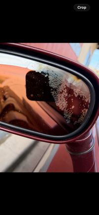 Water got behind the glass of the mirror, plus a b