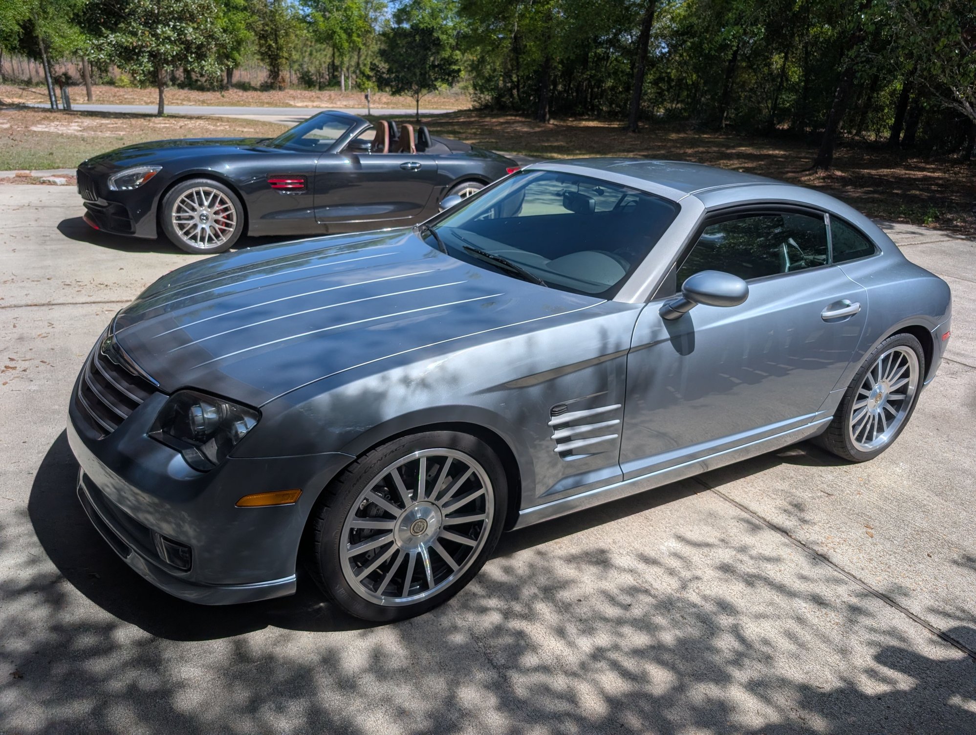 Waiting next to go to its new home, parked next to the Crossfires eventual successor, the R190 AMG GT.  