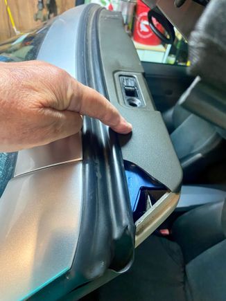 Plastic panel that covers the top of the windshield 