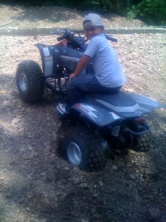 My oldest son, Waylen the day he got his new Raptor 80 on his 9 th Birthday.. got it stuck within a couple hours.. ATTA BOY!