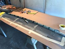 Trim side at angle first and secure with masking tape