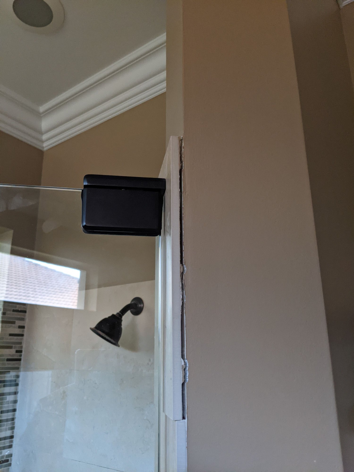 Frameless shower door loose at top Community Forums