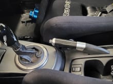 AMS Delrin shift knob (no too hot or too cold issues), Mitsubishi OEM carbon fiber e-brake handle.  Also pictured is Racetech 4009W fixed-back seats with Schroth 6 point harnesses.