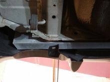 I need to build some sort of support bracket to take advantage of the factory push-pin location that holds the bottom up?  See the plastic hole?