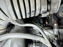 Nipple location hidden under turbo compressor inlet pipe