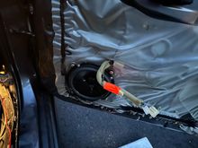 New speaker screwed into bracket and mounted in door.