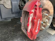 Front caliper with pins and spring removed