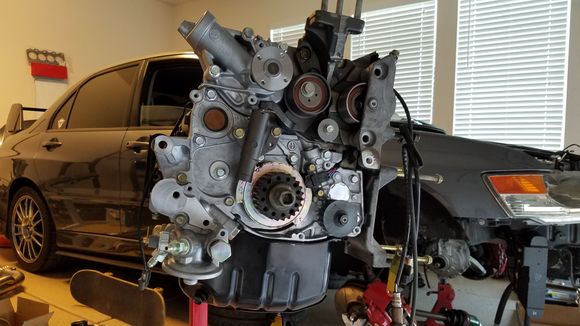 After bolting on a new water pump, balance shaft sprocket spacer, trigger plate, crank gear, cylinder block bracket, ac bracket, and power steering bracket.