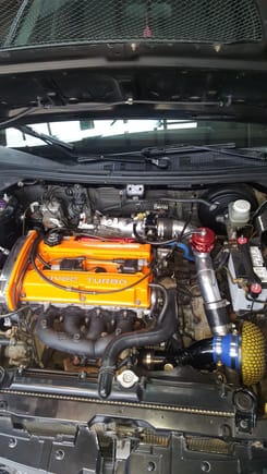 here is a current pciture of engine bay. i had the fp race manifold cermaic coated. added light weight battery. tial bov. clear timing cover so i can keep an eye on timing.