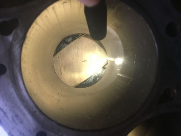 Here is cylinder number 2 with the damage. You can see the knicks from the valve head.