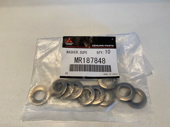 Mitsubishi OEM heavy-duty super washers (p/n MR187848). They are Belleville spring washers. 2 are needed for each manifold-to-turbo bolt.