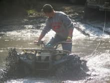 Me draggin a winch line through the swamp on my kodiak, the white truck was stuck again