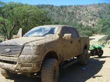 the wrecked bike and the muddy truck.