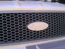 Here is the faded tan colored grill. Taped off and ready for paint.