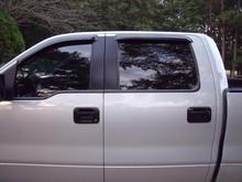 painted my chrome door handles and rain shields black!