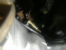 T installed the oem sensor is pointing to the whell well and the -4 line comes out towards the front of the motor