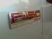 another angle of side emblem with metallic red inset