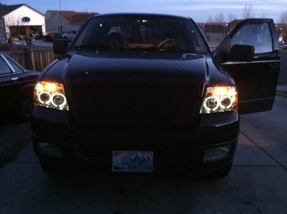 Spyder Projection Smoked "Halo" Headlights, Matching Taillights.  Option Racing Grille, Plasti-Dipped Wheels & Emblems.