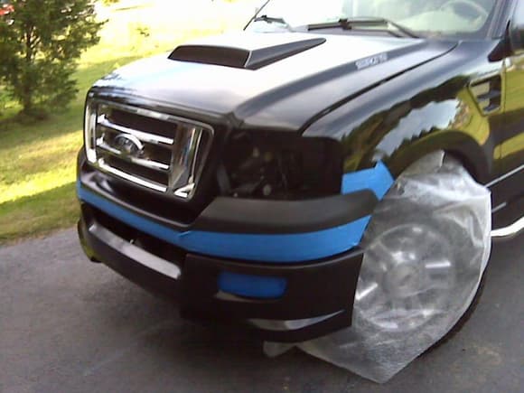 Bumper fitted and cover installed with 3m tape and stainless screws.  Taped to get ready to paint.