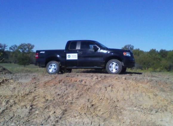 On a small hill off a lease road.