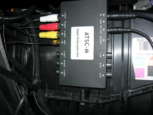 F150 HU install digital tv tuner velcroved to heater box behind glove box.