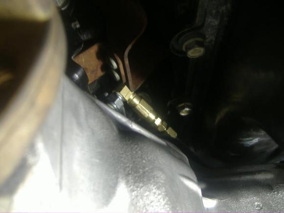 T installed the oem sensor is pointing to the whell well and the -4 line comes out towards the front of the motor