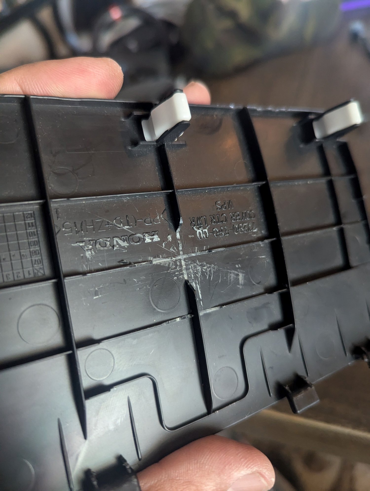 Cleaned off area with razor blade to drill the hole for the light.