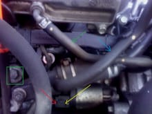 Starter position on the engine, radiator removed. To undo ignition terminal connector press on the tab where red arrow is , than GENTLY pry the other end with flat screwdriver. Chances are this connector will be broken in most cases. For best result do it on the warm engine, not when engine is cold! green arrow points to PCV hose , blue arrow to throttle body heating line, block draining bolt is in the green box. The designer of this layout deserves Shnobel's prize! 