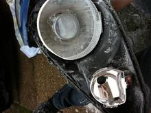 Chrome dish cut to fit projector backing.