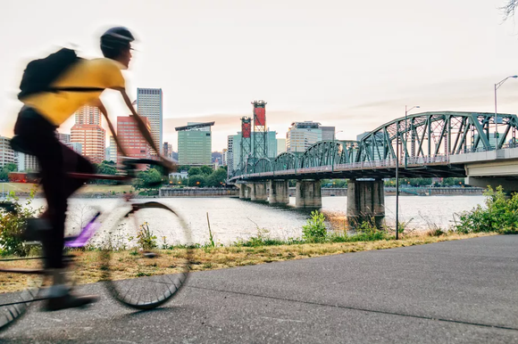 A cyclist in Portland, Oregon. A new report on traffic congestion suggests that the city’s investment in multimodal transit have helped lessen congestion and traffic jams. Shutterstock