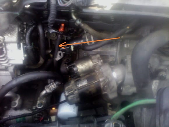 I managed to get it out without removing the oil dipstick tube , just by rotating it certain way (orange arrow)