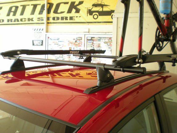 Thule TP42 42 inch Top-Track mounted tracks parallel to each other and not parallel to roof seam.