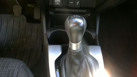 Very small scratches on silver-colored trim by shifter