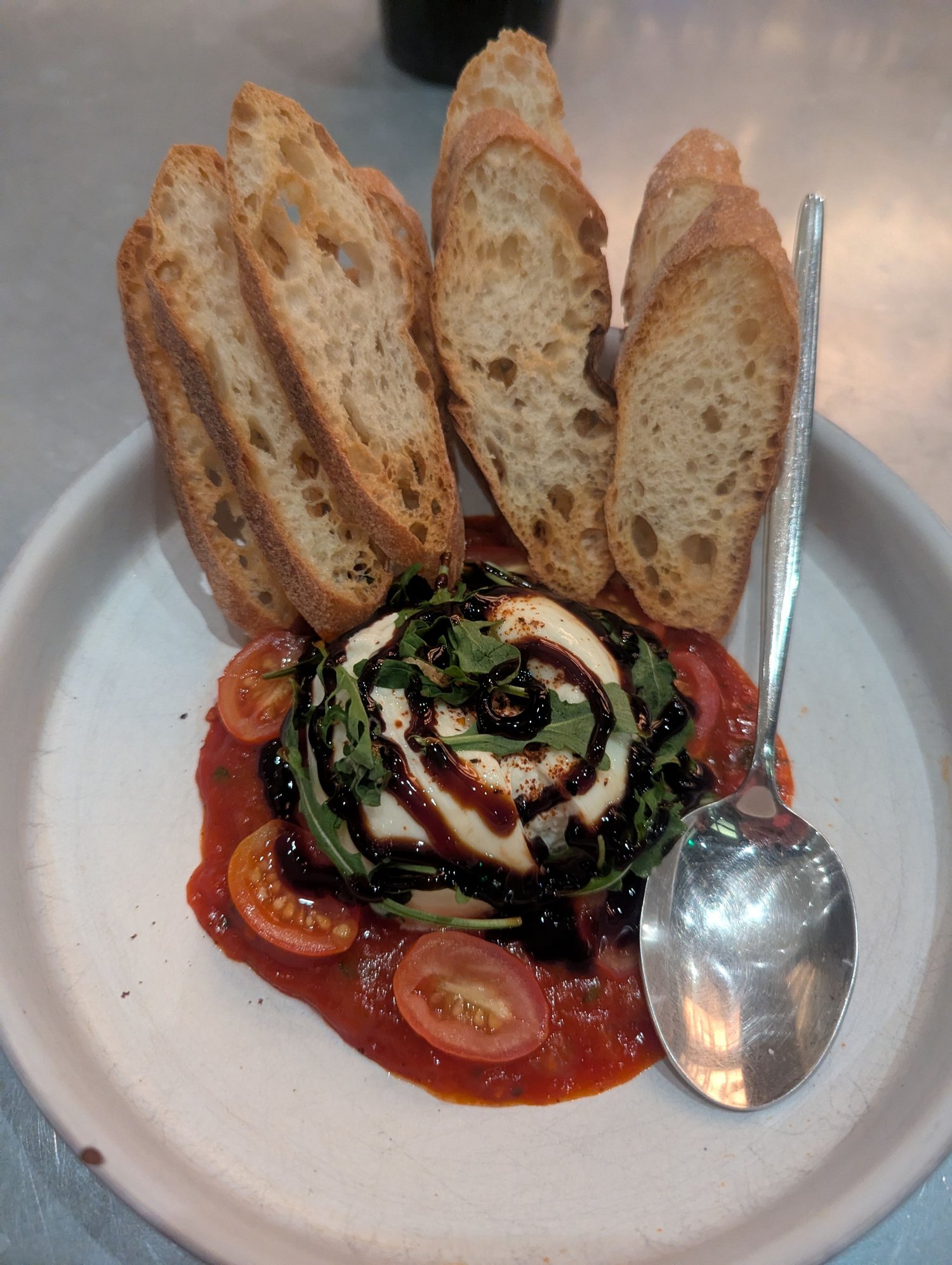 Burrata with a spicy tomato sauce. Yum
