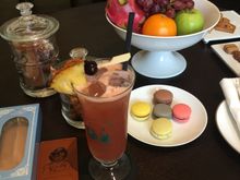 Raffles Singapore. With 3 apples no less! :D
The drink (Singapore Sling) is their welcome drink. 