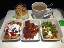 Buttermilk waffles, yogurt parfait, maple glazed bacon, chicken sausage hash