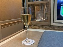 Champagne on take off and one side of mini bar behind. 