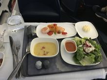 MSP-HND. First course. The shrimp with truffle mousse was excellent. Soup was good. Salad meh. 