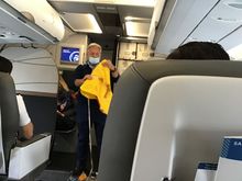 Mask stayed like this through entire flight. Two passengers in front of me removed masks for animated long  conversation. 