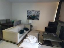 1BR residence kitchen and living room.