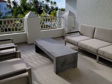 large outdoor patio with partial ocean and pool view (advertised as "garden view" but it is better than that)