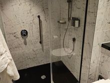 Rainfall and normal showers.  Lots of pressure that can't be changed, so the floor will get wet.
No issues with temperature
