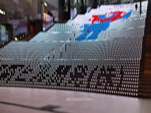 Led Light show on the steps going to the roof garden at kyoto station. This element was showing the expo 2025 osaka logo. Music was playing also
