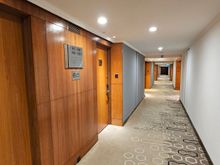 Corridor.
4 elevators, just behind me, controlled keycards.
